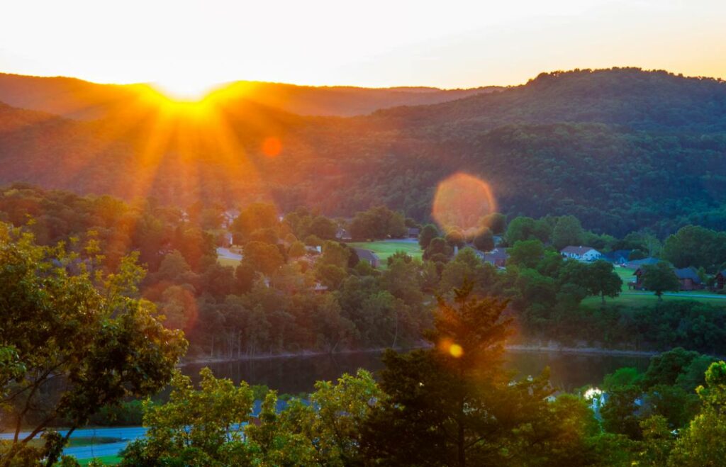 Sunrise over Eureka Springs behind the lakes of the Ozark Mountains.