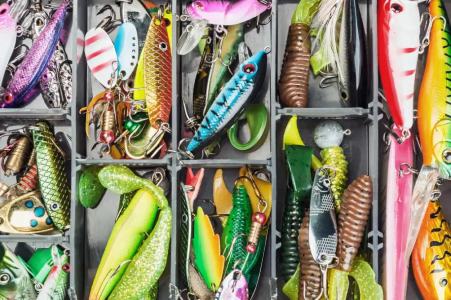 Closeup of fishing lures and accessories in a box. 