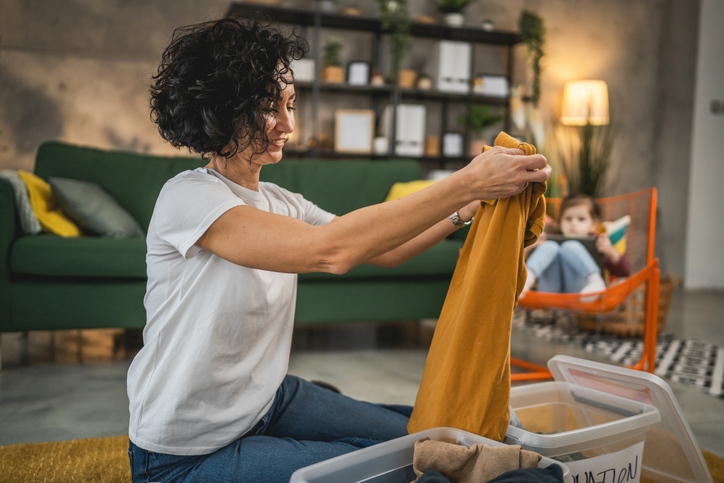 Woman Folding clothing