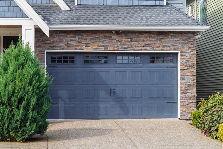 A blue garage door that is closed
